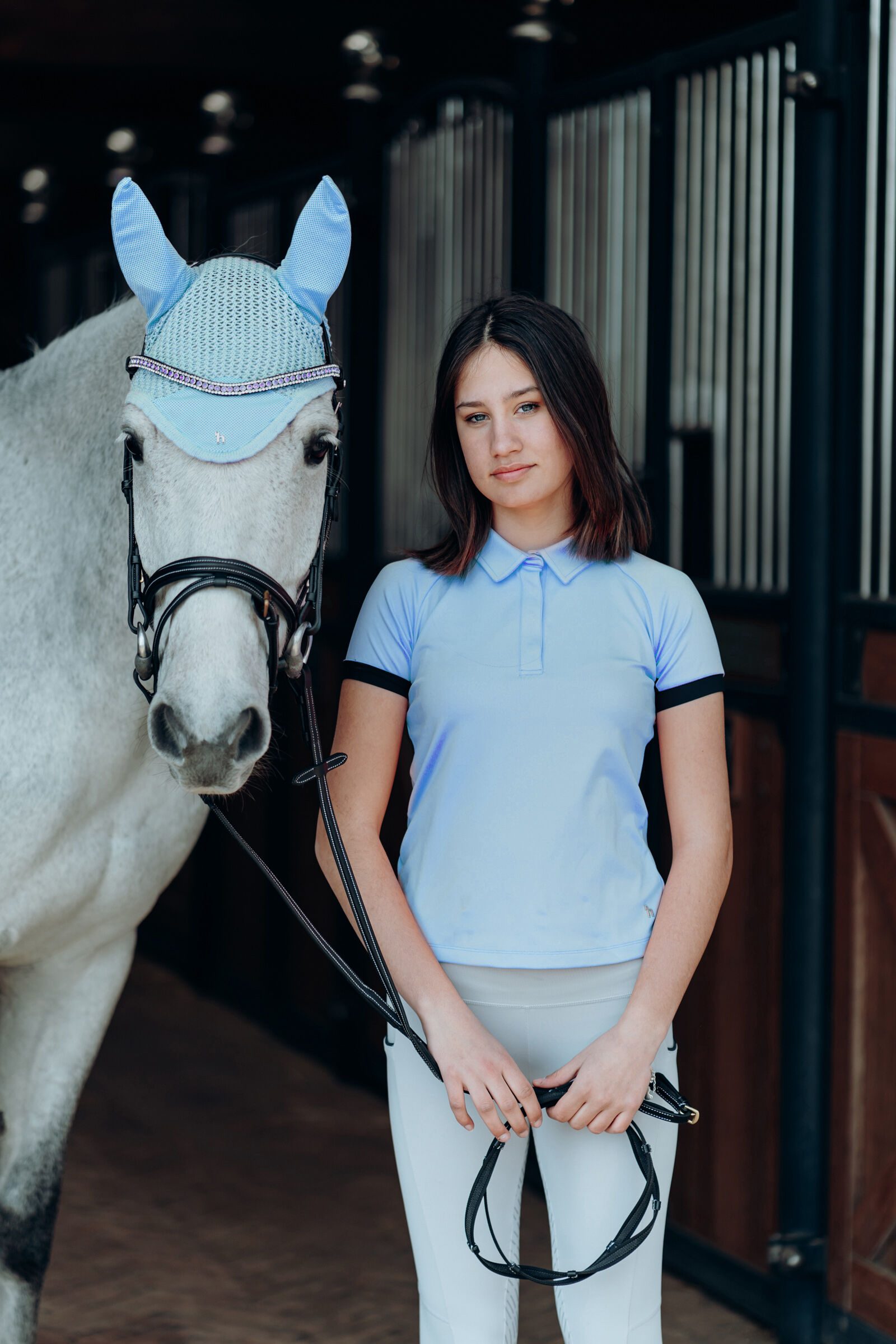 White polo shirt with light blue horse store